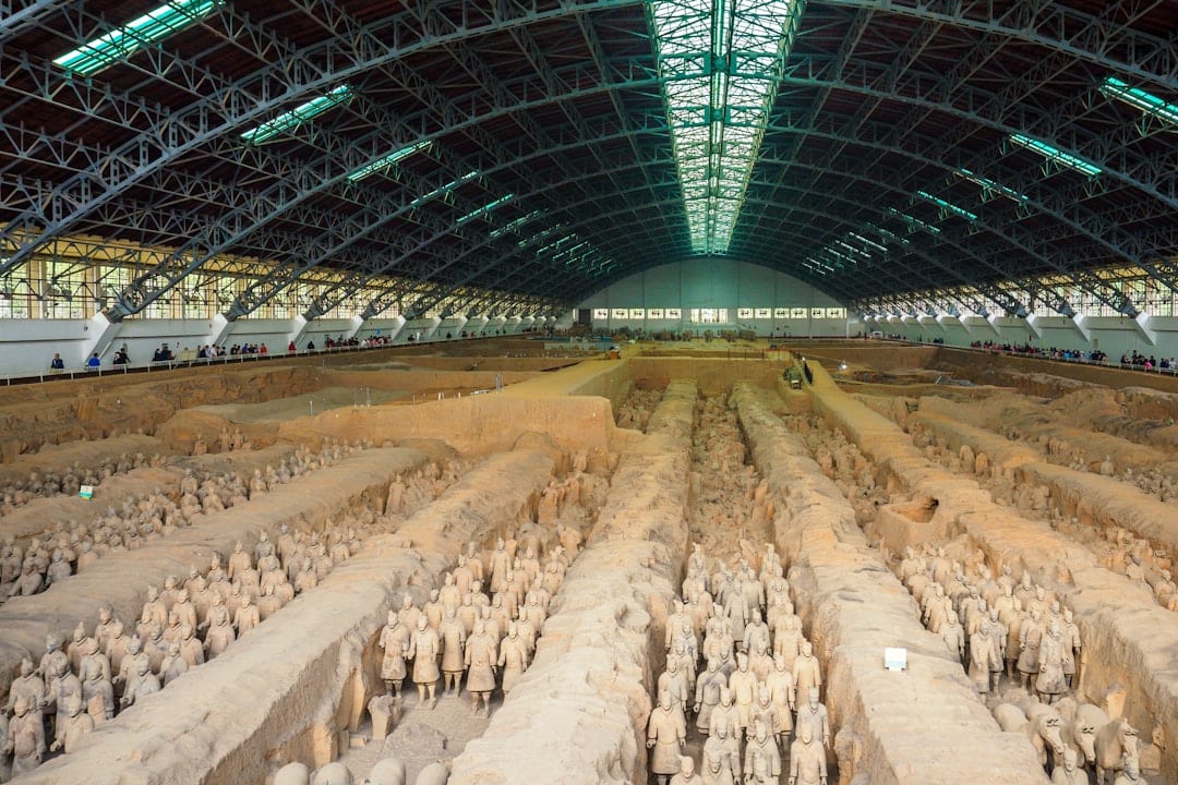 Ancient Terracotta Army warriors in dramatic museum lighting at Xi'an