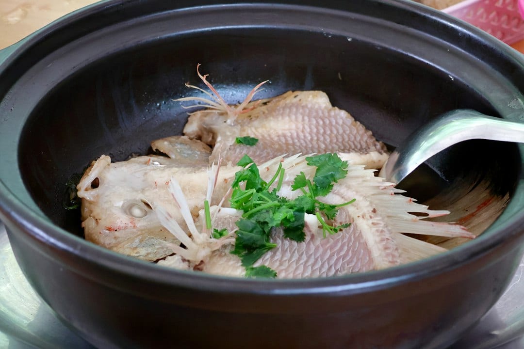 Guilin beer fish in traditional clay pot