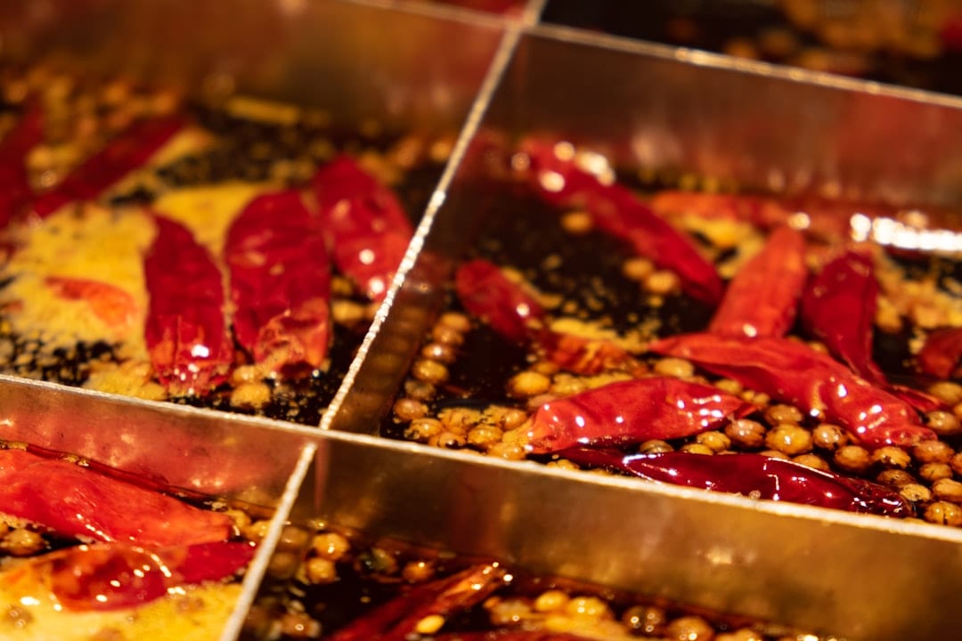 Chongqing Sichuan hotpot with bubbling red broth and fresh ingredients