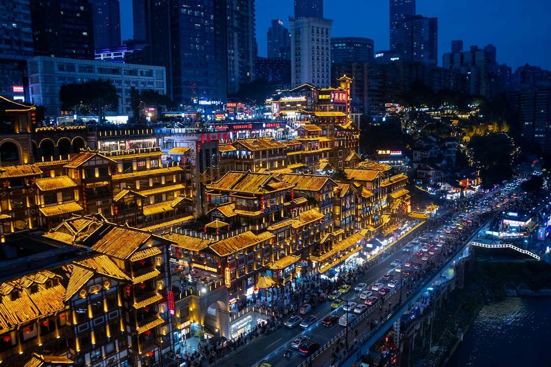 Chongqing panoramic skyline at dusk with illuminated buildings along the Yangtze River