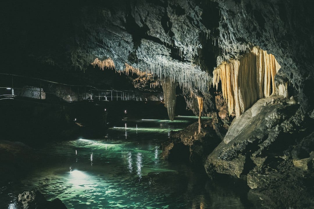 Dragon Palace Cave underground river with stalactites