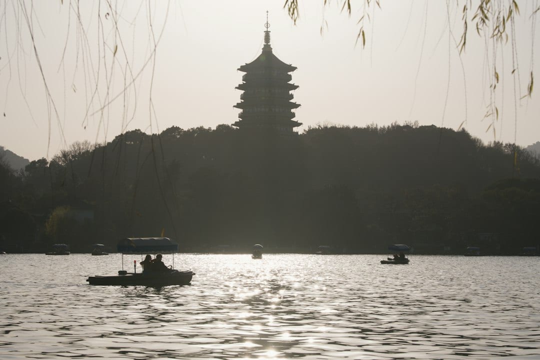 Hangzhou West Lake scenic landscape with pagoda silhouette