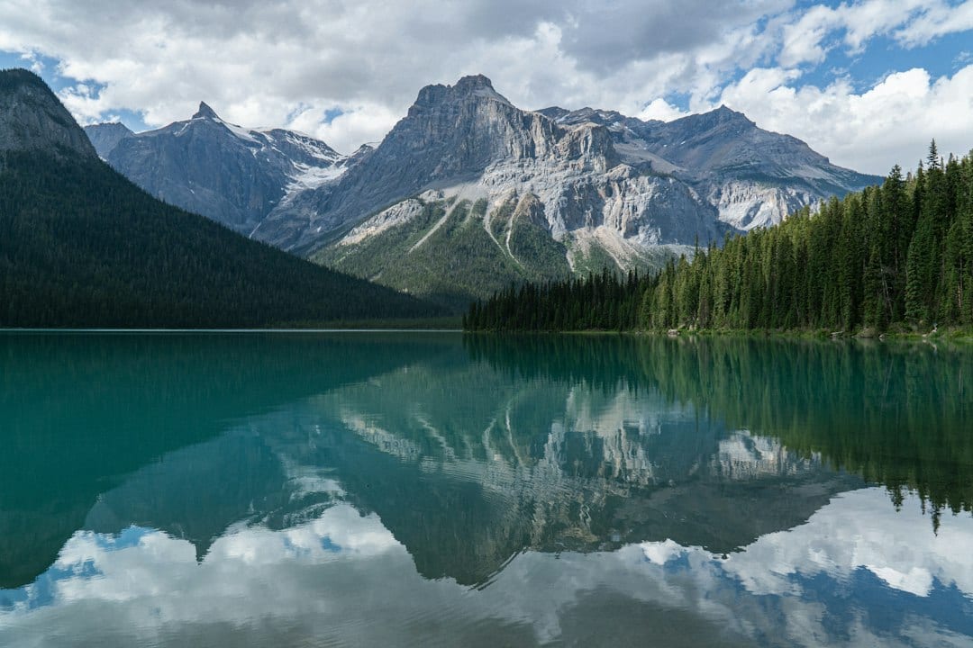 Kanas Lake in Northern Xinjiang with stunning autumn foliage and mountain backdrop
