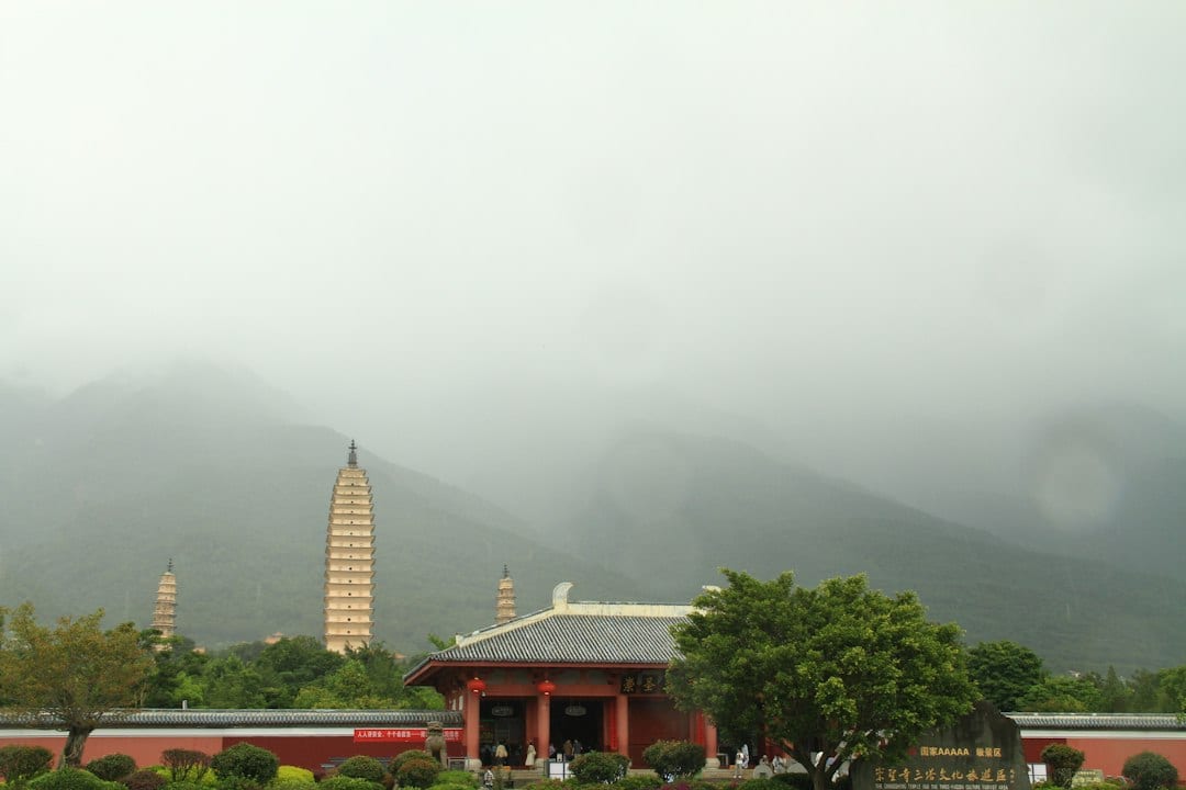 Lingyin Temple and pagodas against misty mountains