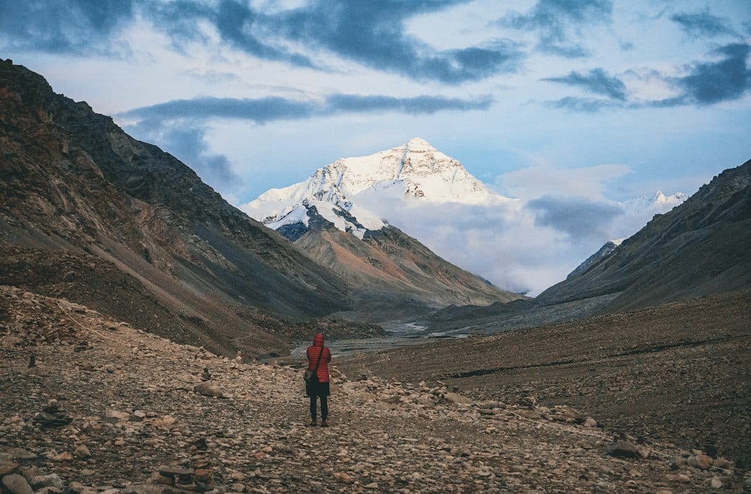 A traveler gazes toward Mount Everest from Tibet