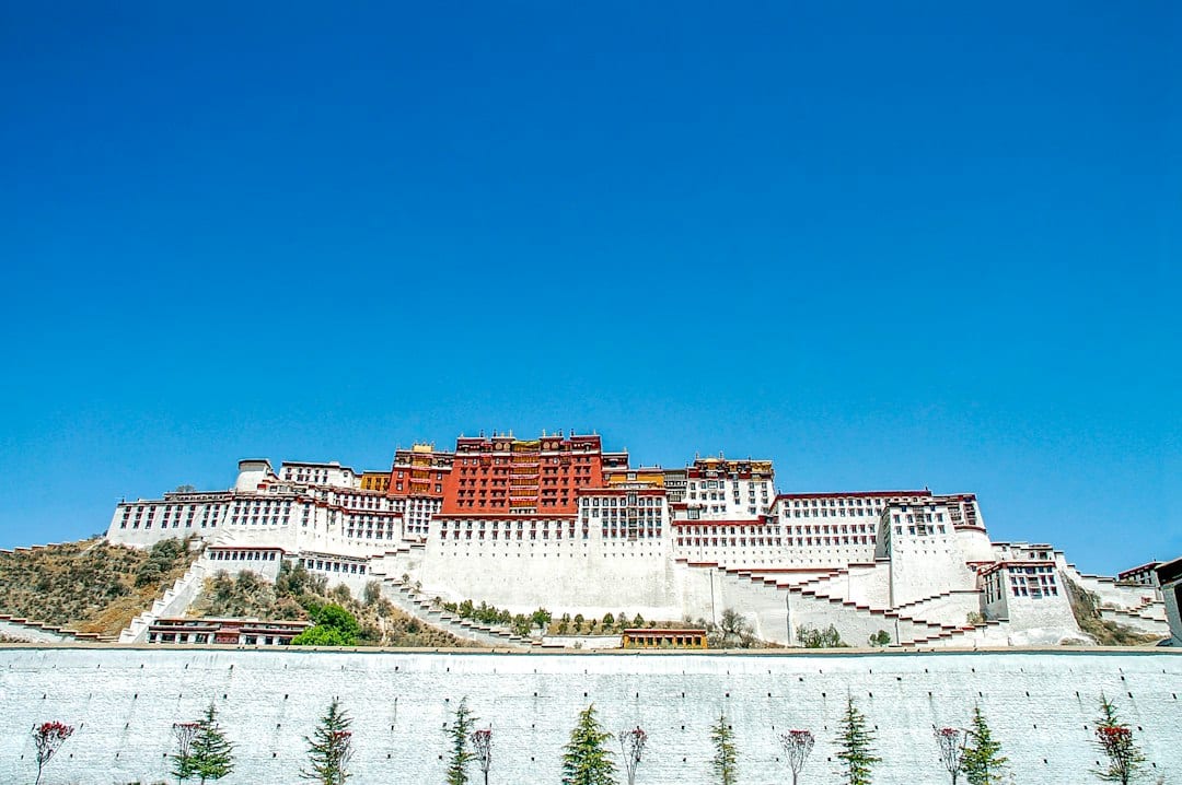 Potala Palace rising above Lhasa under a blue sky
