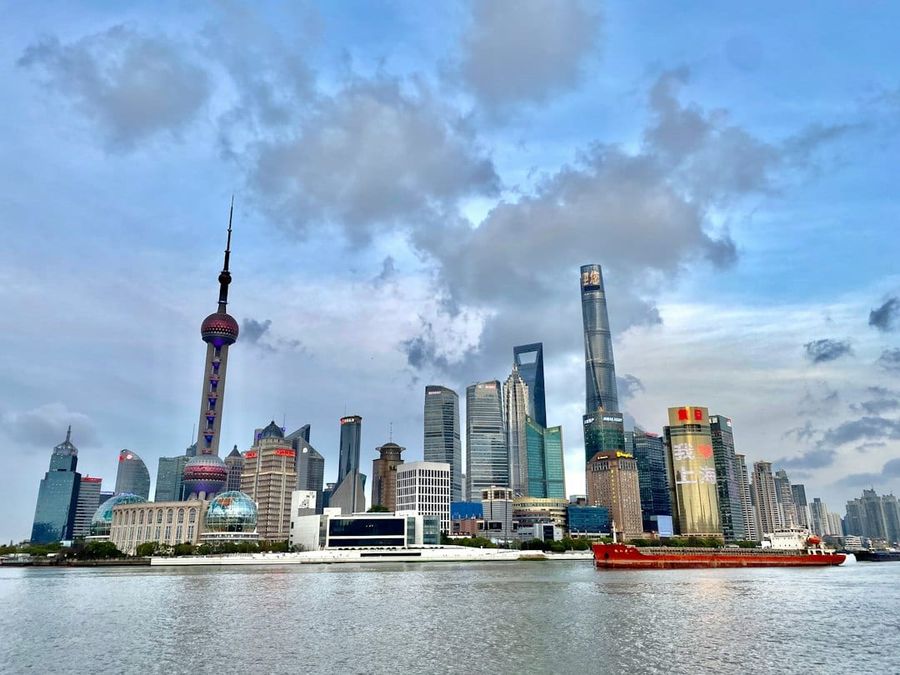 A large body of water with a city in the background