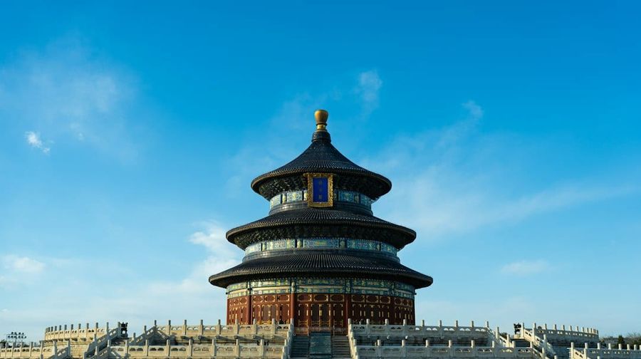Temple of Heaven circular hall under a bright blue sky in Beijing