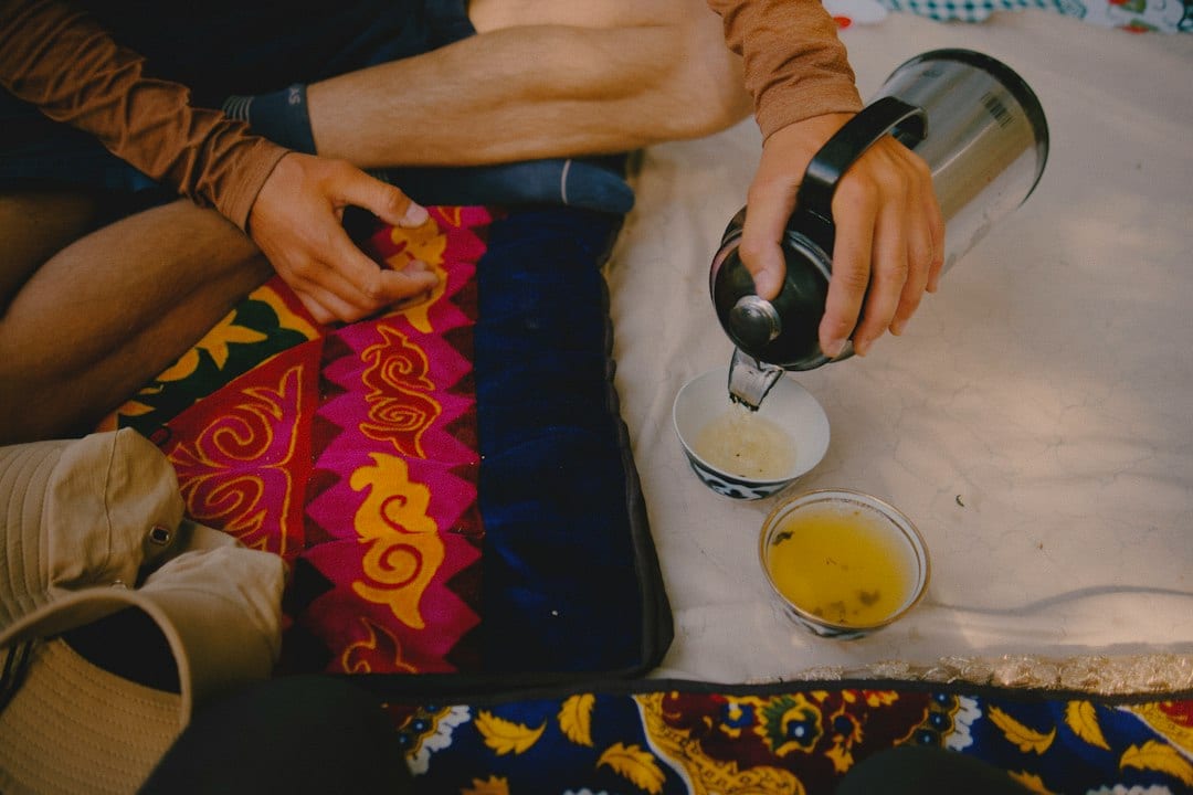 Butter tea being poured into a traditional bowl