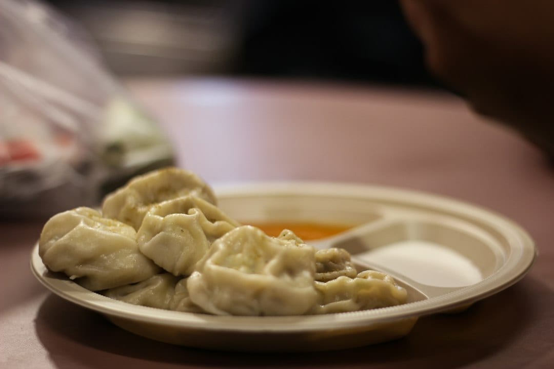 Steamed Tibetan momo dumplings served with dipping sauce