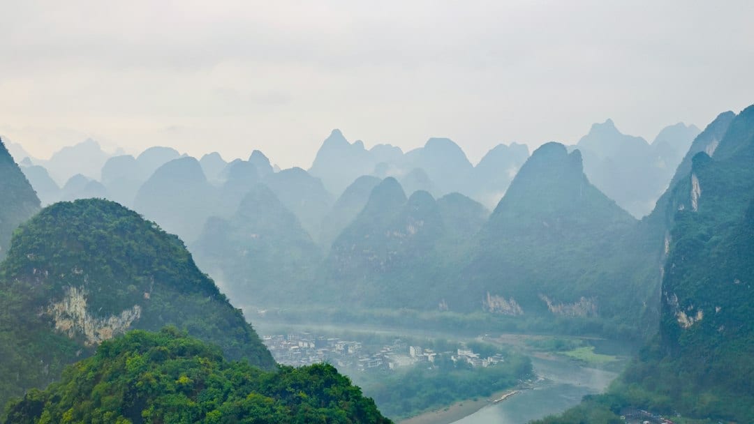 Wulong Karst natural stone bridge with lush green valley