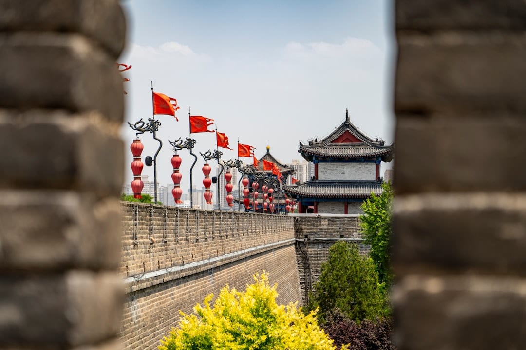 Ancient city wall of Xi'an at sunset with traditional architecture