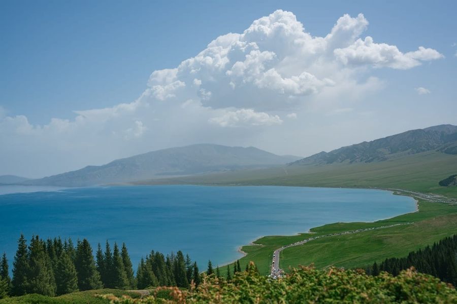 Kanas Lake with golden autumn forests and mountain peaks
